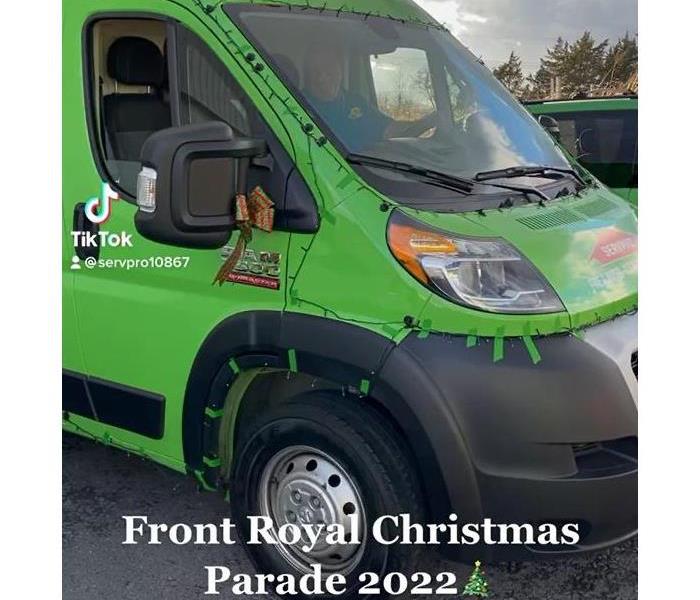 SERVPRO van with holiday decorations and Christmas Lights